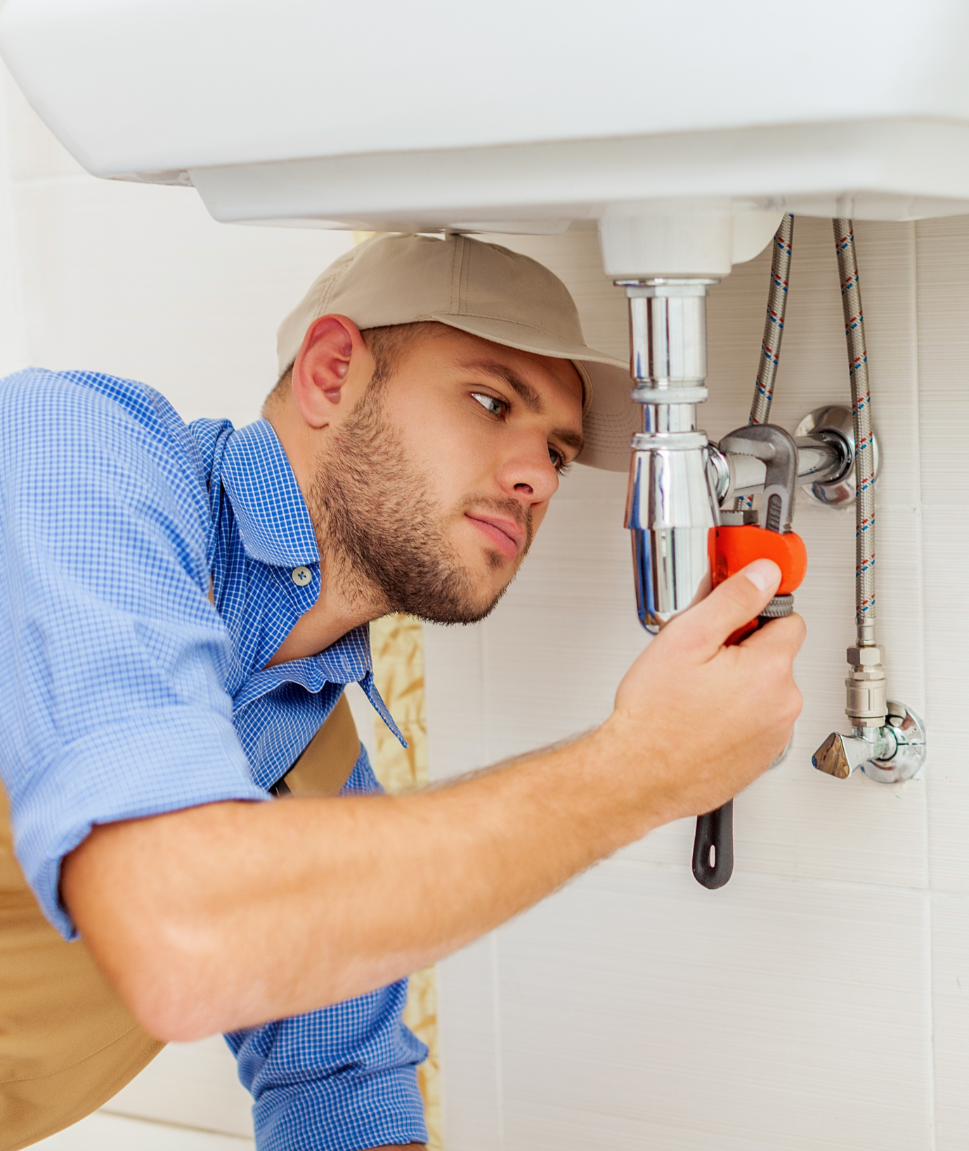 Plumber repairing a sink drain